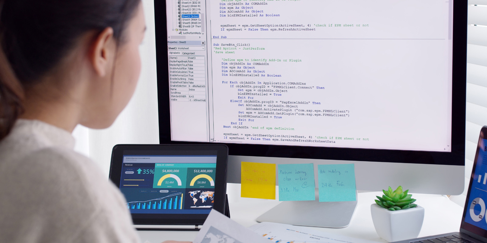 Female is working on code development with desktop computer.