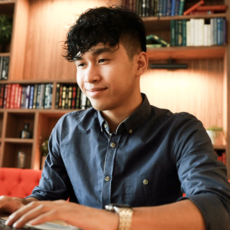 Man working with laptop in the library.